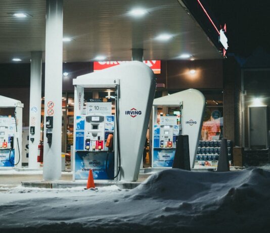 A well-lit gas station surrounded by snow during a winter night in St. John's, NL, Canada.