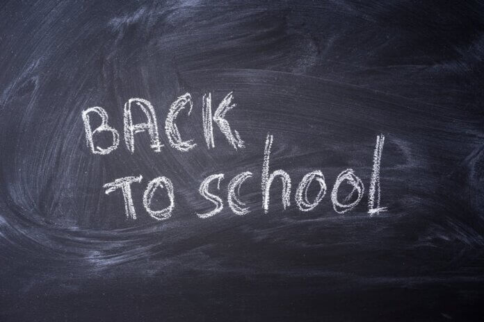 Blackboard with 'Back to School' written in chalk, ideal for educational themes. Blackboard with 'Back to School' written in chalk, ideal for educational themes.