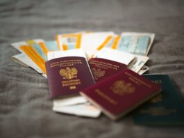 Close-up of Polish passports and travel tickets symbolizing travel and adventure.