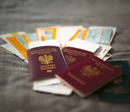 Close-up of Polish passports and travel tickets symbolizing travel and adventure.