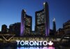 Канада на форуме ООН обсудила с мировыми партнёрами миграционные приоритеты Toronto City Hall stands illuminated against the night sky, showcasing vibrant city lights and iconic architecture.