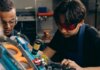 Британская Колумбия инвестирует $40 млн в обучение рабочим профессиям Two young engineers concentrating on precision work in a technical workshop, wearing safety goggles.
