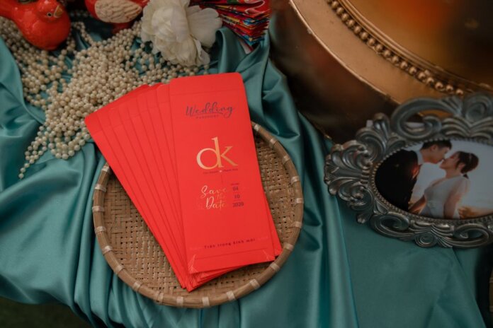 A beautifully arranged wedding invitation with pearls and a romantic photo. A beautifully arranged wedding invitation with pearls and a romantic photo.