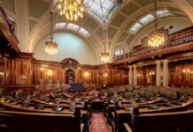 Канада выделяет $60 млн на поддержку лесопильной компании A beautifully designed chamber room with ornate woodwork and chandeliers in the UK.