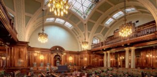 Канада выделяет $60 млн на поддержку лесопильной компании A beautifully designed chamber room with ornate woodwork and chandeliers in the UK.