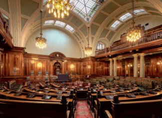 Канада выделяет $60 млн на поддержку лесопильной компании A beautifully designed chamber room with ornate woodwork and chandeliers in the UK.