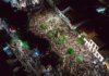 Два подростка арестованы за нападение на полицию в Лондоне, Онтарио A lively aerial view of a crowded nighttime street festival with illuminated streets.
