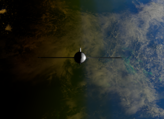 A satellite orbiting Earth showcasing contrasts between ocean and land from space.