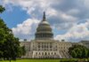 A stunning view of the iconic United States Capitol under a blue sky in Washington, D.C.