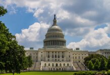 A stunning view of the iconic United States Capitol under a blue sky in Washington, D.C.