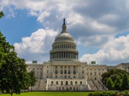 A stunning view of the iconic United States Capitol under a blue sky in Washington, D.C.