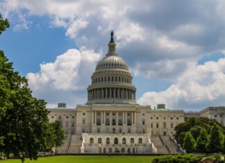A stunning view of the iconic United States Capitol under a blue sky in Washington, D.C.
