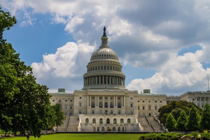A stunning view of the iconic United States Capitol under a blue sky in Washington, D.C. A stunning view of the iconic United States Capitol under a blue sky in Washington, D.C.