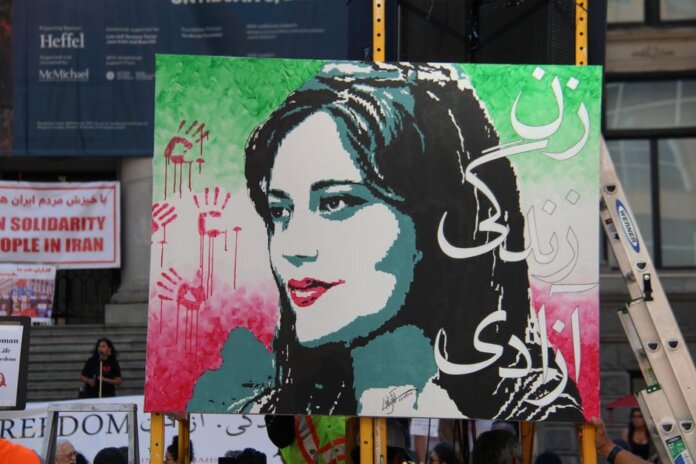 Artistic protest sign highlighting women's rights at a Vancouver demonstration. Artistic protest sign highlighting women's rights at a Vancouver demonstration.