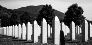 Black and white image of the Srebrenica cemetery, commemorating tragic history.