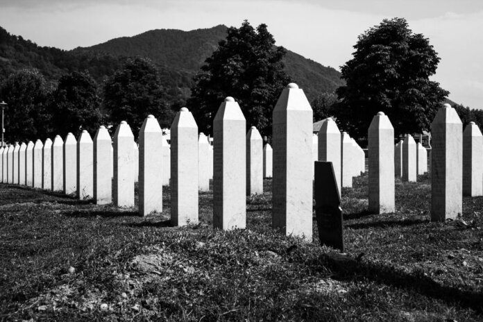 Black and white image of the Srebrenica cemetery, commemorating tragic history. Black and white image of the Srebrenica cemetery, commemorating tragic history.