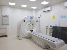 Bright and sterile hospital imaging room featuring a state-of-the-art CT scanner.