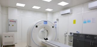 Bright and sterile hospital imaging room featuring a state-of-the-art CT scanner.
