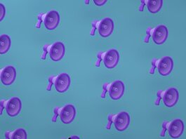 Bright purple megaphones pattern on a blue backdrop creating an abstract and modern visual.
