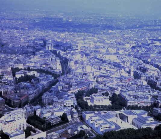 Captivating aerial view of the sprawling cityscape of Paris with iconic landmarks visible.
