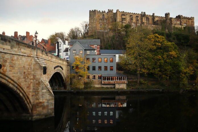 Captivating view of Durham Castle and Framwellgate Bridge over the river. Captivating view of Durham Castle and Framwellgate Bridge over the river.