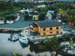 Charming aerial view of Quidi Vidi village and harbor with boats and colorful houses in St. John's, Newfoundland.