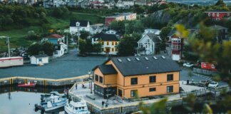 Charming aerial view of Quidi Vidi village and harbor with boats and colorful houses in St. John's, Newfoundland.
