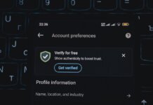 Close-up of a smartphone screen displaying account verification alert. Ideal for security and authenticity themes.