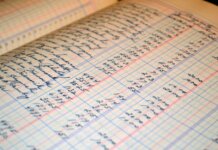 Консерваторы требуют отчётности за бонусы руководству Canada Post Close-up of a vintage handwritten ledger detailing financial records and accounts.