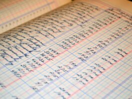 Close-up of a vintage handwritten ledger detailing financial records and accounts.
