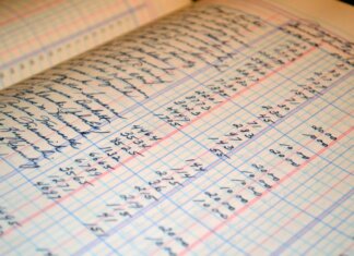 Close-up of a vintage handwritten ledger detailing financial records and accounts.