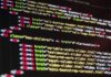 Meta AI теперь не только думает, но и действует за пользователя Close-up of HTML code highlighted in vibrant colors on a computer monitor.