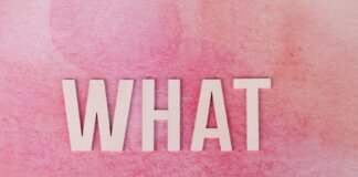 Creative pink background with the word 'WHAT' in bold white letters.