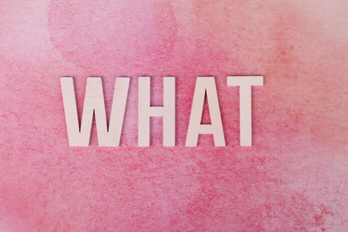 Creative pink background with the word 'WHAT' in bold white letters. Creative pink background with the word 'WHAT' in bold white letters.