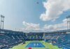 Канада удвоит пожертвования на гуманитарную помощь Венесуэле — до $7 млн Dynamic tennis match in progress at an outdoor stadium in Toronto 2015 event, with vibrant sky and audience.