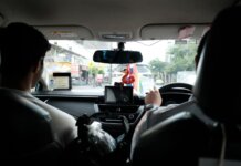 Experience a typical taxi ride through the streets of Bangkok, Thailand.