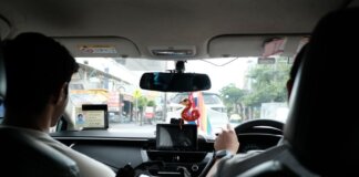 Experience a typical taxi ride through the streets of Bangkok, Thailand.