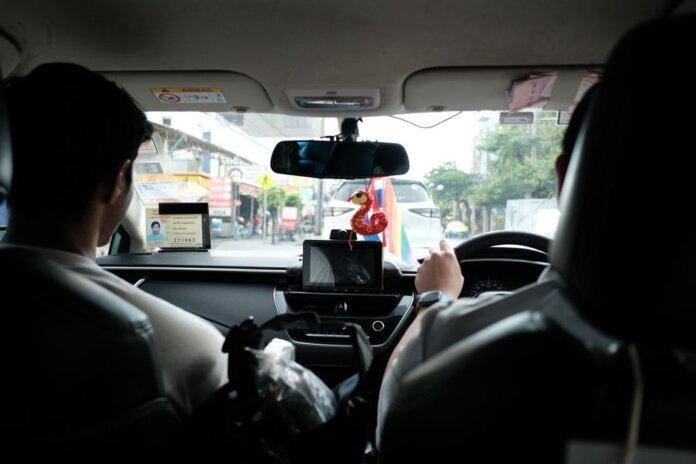 Experience a typical taxi ride through the streets of Bangkok, Thailand.