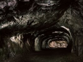 Explore the mysterious rocky tunnel with natural geological formations.
