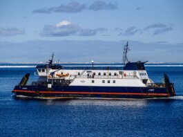 Ferry navigating clear blue North Atlantic waters near Bell Island, NL, Canada.