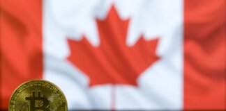 Golden Bitcoin coin displayed in front of a blurred Canadian flag symbolizing cryptocurrency in Canada.