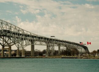 Iconic Blue Water Bridge spanning between the USA and Canada over clear waters.