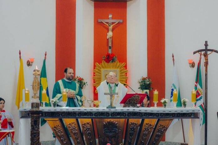 Priests conducting a Catholic mass ceremony in a church with religious artifacts and crosses. Priests conducting a Catholic mass ceremony in a church with religious artifacts and crosses.