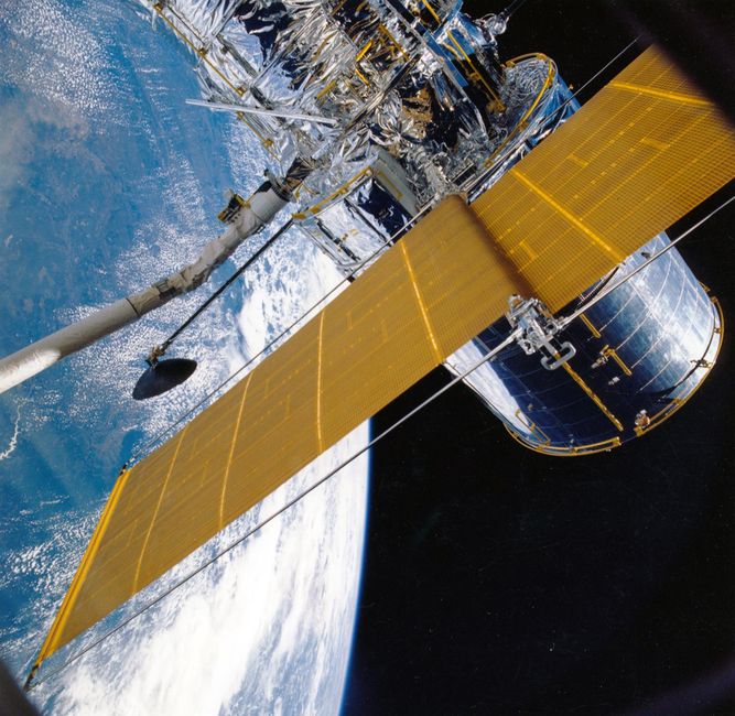 Spacecraft with solar panels orbiting Earth, showcasing modern astronautic technology. Spacecraft with solar panels orbiting Earth, showcasing modern astronautic technology.