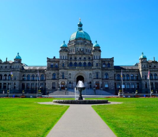 Stunning view of the British Columbia Parliament Building with clear blue sky.