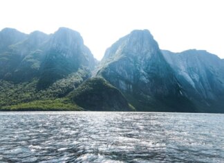 Stunning view of towering mountains and shimmering sea in Gros Morne, Newfoundland, Canada.