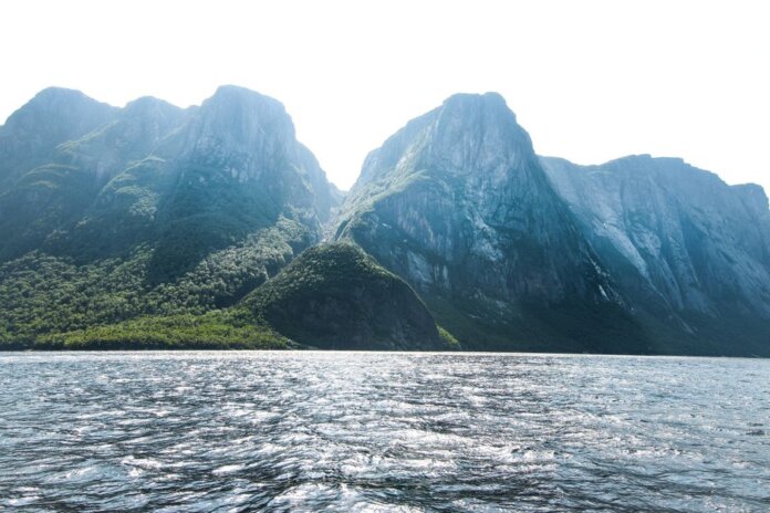 Stunning view of towering mountains and shimmering sea in Gros Morne, Newfoundland, Canada. Stunning view of towering mountains and shimmering sea in Gros Morne, Newfoundland, Canada.