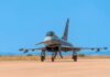 Беспилотные самолёты для самых труднодоступных мест Канады A military jet fighter on the runway ready for takeoff against a bright blue sky.