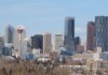 A stunning view of Calgary's skyline featuring the iconic Calgary Tower against a clear sky.