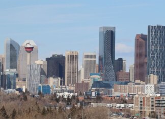 A stunning view of Calgary's skyline featuring the iconic Calgary Tower against a clear sky.